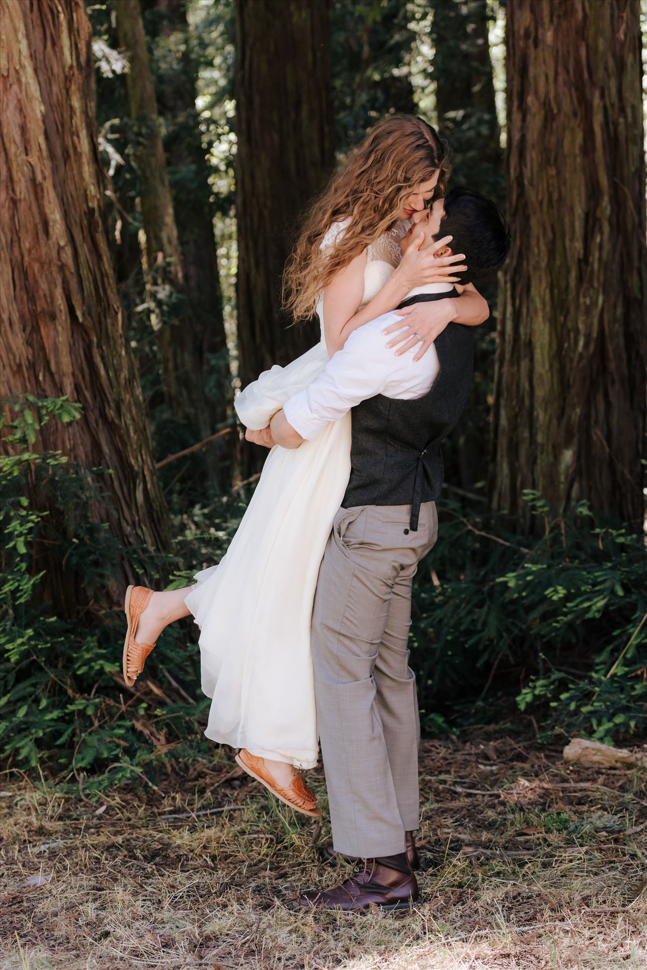FW-6277.JPG - Mt Madonna wedding in the redwoods outside of Watsonville, California with a romantic and classic vibe by sarah williams of mirror's edge photography a san luis obispo wedding photographer.  Groom lifts Bride by Sarah Williams