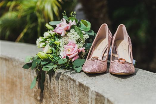Wedding at Dolphin Bay Resort and Spa in Shell Beach, California by Sarah Williams of Mirror's Edge Photography, a San Luis Obispo County Wedding Photographer. Rings and shoes at Dolphin Bay Resort