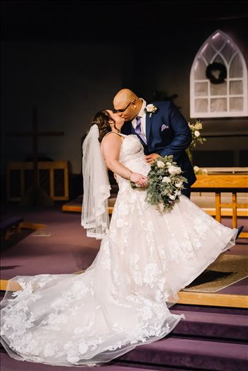 Sarah Williams of Mirror's Edge Photography and San Luis Obispo and Santa Barbara Wedding Photographer captures the Ochoa Wedding. Bride and Groom Kiss at Trinity Church.