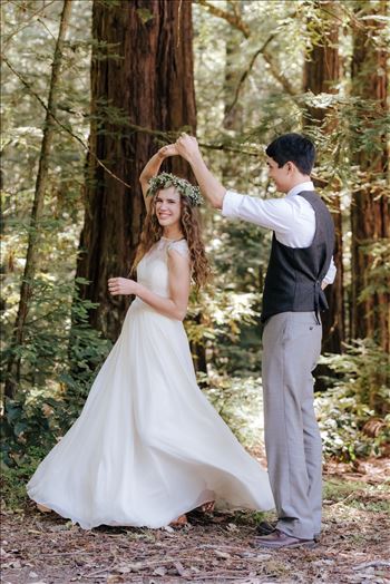 Mt Madonna wedding in the redwoods outside of Watsonville, California with a romantic and classic vibe by sarah williams of mirror's edge photography a san luis obispo wedding photographer.  Bride and Groom dancing in the forest