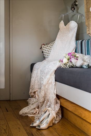 Wedding photography at the Kimpton Goodland Hotel in Santa Barbara California by Mirror's Edge Photography.  Wedding dress, flowers and shoes in Airstream