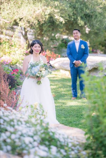 Mirror's Edge Photography captures Maryanne and Michael's magical wedding in the Secret Garden at the iconic Madonna Inn in San Luis Obispo, California. Beautiful Bride in the garden
