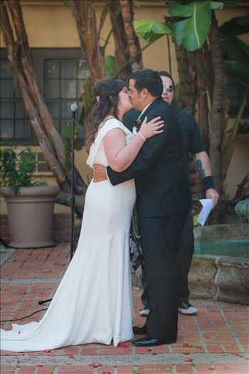 Wedding photography at the Historic Santa Maria Inn in Santa Maria, California by Mirror's Edge Photography. First Kiss of Bride and Groom.