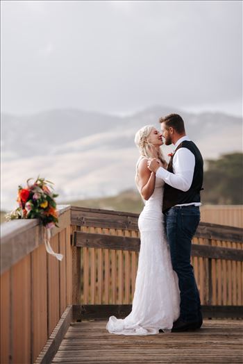 Mirror's Edge Photography, a San Luis Obispo County Wedding and Engagement Photographer, captures Sarah and Jeremy's intimate wedding on Pismo State Beach in Grover Beach, California.  Bride and Groom dancing on the boarding to Pismo