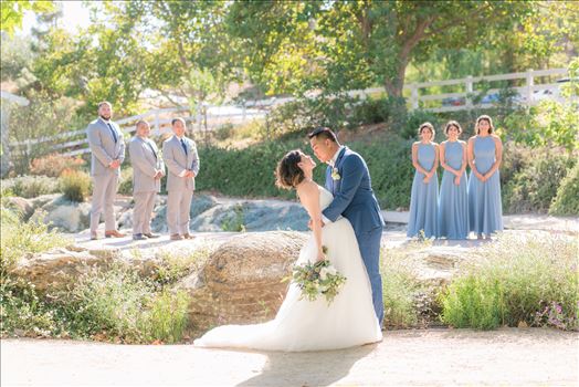 Mirror's Edge Photography captures Maryanne and Michael's magical wedding in the Secret Garden at the iconic Madonna Inn in San Luis Obispo, California. The Bridal Party in the Secret Garden