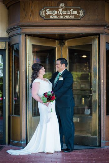 Wedding photography at the Historic Santa Maria Inn in Santa Maria, California by Mirror's Edge Photography. Bride and Groom in revolving door.