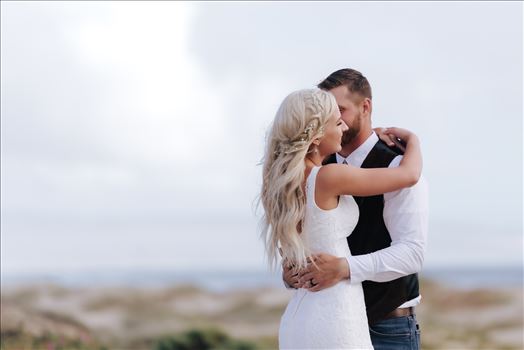 Mirror's Edge Photography, a San Luis Obispo County Wedding and Engagement Photographer, captures Sarah and Jeremy's intimate wedding on Pismo State Beach in Grover Beach, California.  Bride and Groom with ocean in the background
