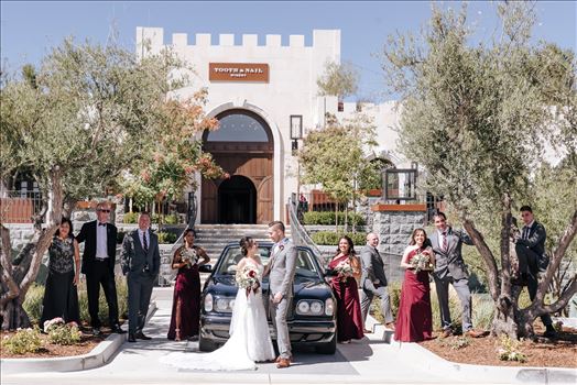 Mirror's Edge Photography captures Edith and Kyle's wedding at the Tooth and Nail Winery in Paso Robles California. Bride, Groom and family by the getaway car