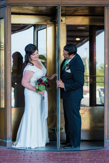 Wedding photography at the Historic Santa Maria Inn in Santa Maria, California by Mirror's Edge Photography. Bride and Groom revolving door entrance.