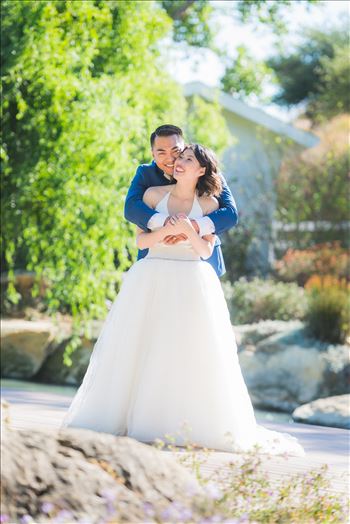 Mirror's Edge Photography captures Maryanne and Michael's magical wedding in the Secret Garden at the iconic Madonna Inn in San Luis Obispo, California. Happy couple in the garden