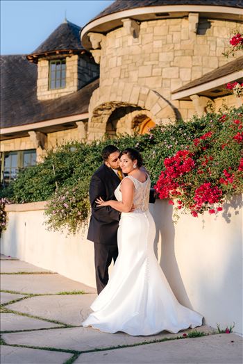 Sarah Williams of Mirror's Edge Photography captures the gorgeous fairy tale wedding day of Victoria and Esteban at the Castle Noland Wedding Venue in San Luis Obispo, California.  Bride and Groom at sunset in front of Castle Noland romatic
