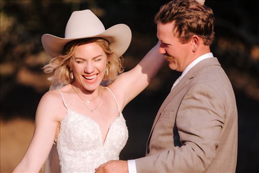 Sarah Williams of Mirror's Edge Photography, a San Luis Obispo and Santa Barbara County Wedding and Engagement Photographer, captures Katie and Joe's country chic wedding in Lompoc, California.  Bride and Groom at the ranch having fun.