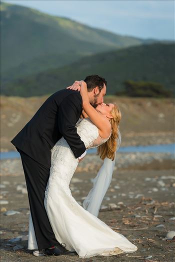 Ragged Point Inn Wedding Elopement photography by Mirror's Edge Photography in San Simeon Cambria California. Bride and groom dip on the sand. Big Sur Wedding Photography
