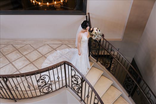 Mirror's Edge Photography captures Edith and Kyle's wedding at the Tooth and Nail Winery in Paso Robles California. Bride getting ready for the First Look on the stairs