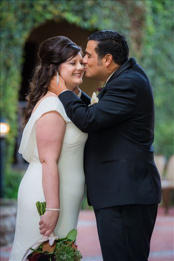 Wedding photography at the Historic Santa Maria Inn in Santa Maria, California by Mirror's Edge Photography. Bride and Groom Hidden Courtyard kiss.