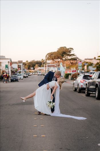 Sarah Williams of Mirror's Edge Photography, a San Luis Obispo Wedding and Engagement Photographer, captures Ryan and Joanna's wedding at the iconic Windows on the Water Restaurant in Morro Bay, California.  Stopping traffic with a dip and kiss