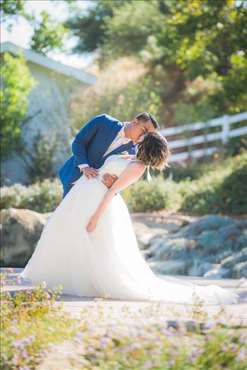 Mirror's Edge Photography captures Maryanne and Michael's magical wedding in the Secret Garden at the iconic Madonna Inn in San Luis Obispo, California. The dip kiss by the pond
