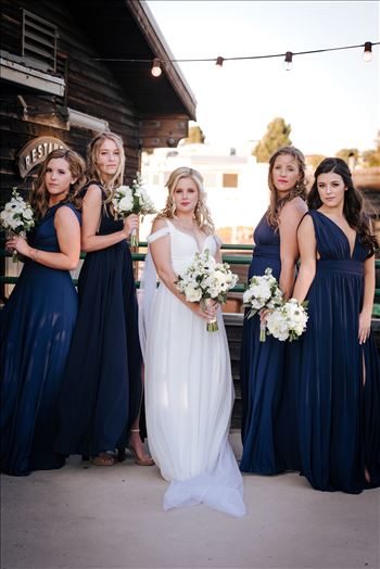 Sarah Williams of Mirror's Edge Photography, a San Luis Obispo Wedding and Engagement Photographer, captures Ryan and Joanna's wedding at the iconic Windows on the Water Restaurant in Morro Bay, California.  Bride and Bridesmaids outside of Windows.