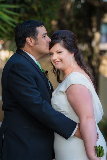 Wedding photography at the Historic Santa Maria Inn in Santa Maria, California by Mirror's Edge Photography.  Bride and groom show love.