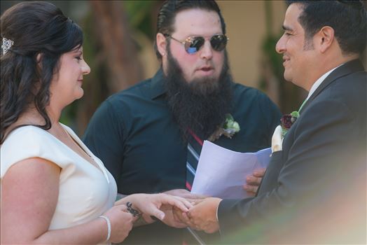 Wedding photography at the Historic Santa Maria Inn in Santa Maria, California by Mirror's Edge Photography. Saying their vows.