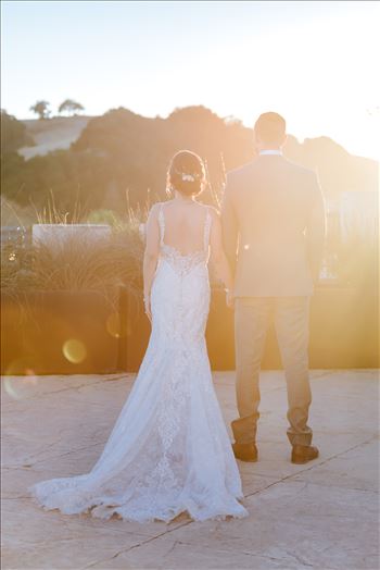 Mirror's Edge Photography captures Edith and Kyle's wedding at the Tooth and Nail Winery in Paso Robles California. Bride and groom watching the sunset