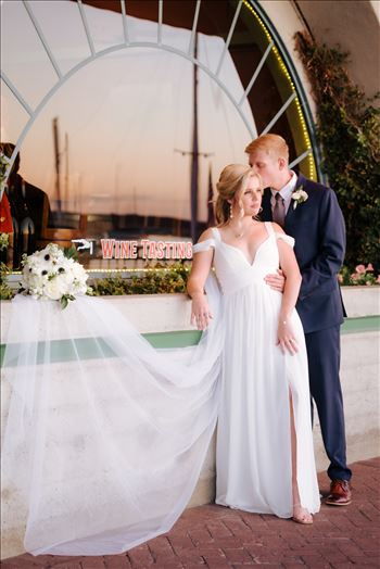 Sarah Williams of Mirror's Edge Photography, a San Luis Obispo Wedding and Engagement Photographer, captures Ryan and Joanna's wedding at the iconic Windows on the Water Restaurant in Morro Bay, California.  Bride and Groom at sunset