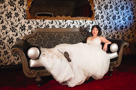 Mirror's Edge Photography captures Maryanne and Michael's magical wedding in the Secret Garden at the iconic Madonna Inn in San Luis Obispo, California. The Bride on the couch in the Crystal Room