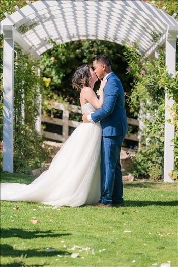 Mirror's Edge Photography captures Maryanne and Michael's magical wedding in the Secret Garden at the iconic Madonna Inn in San Luis Obispo, California. The kiss in the secret garden