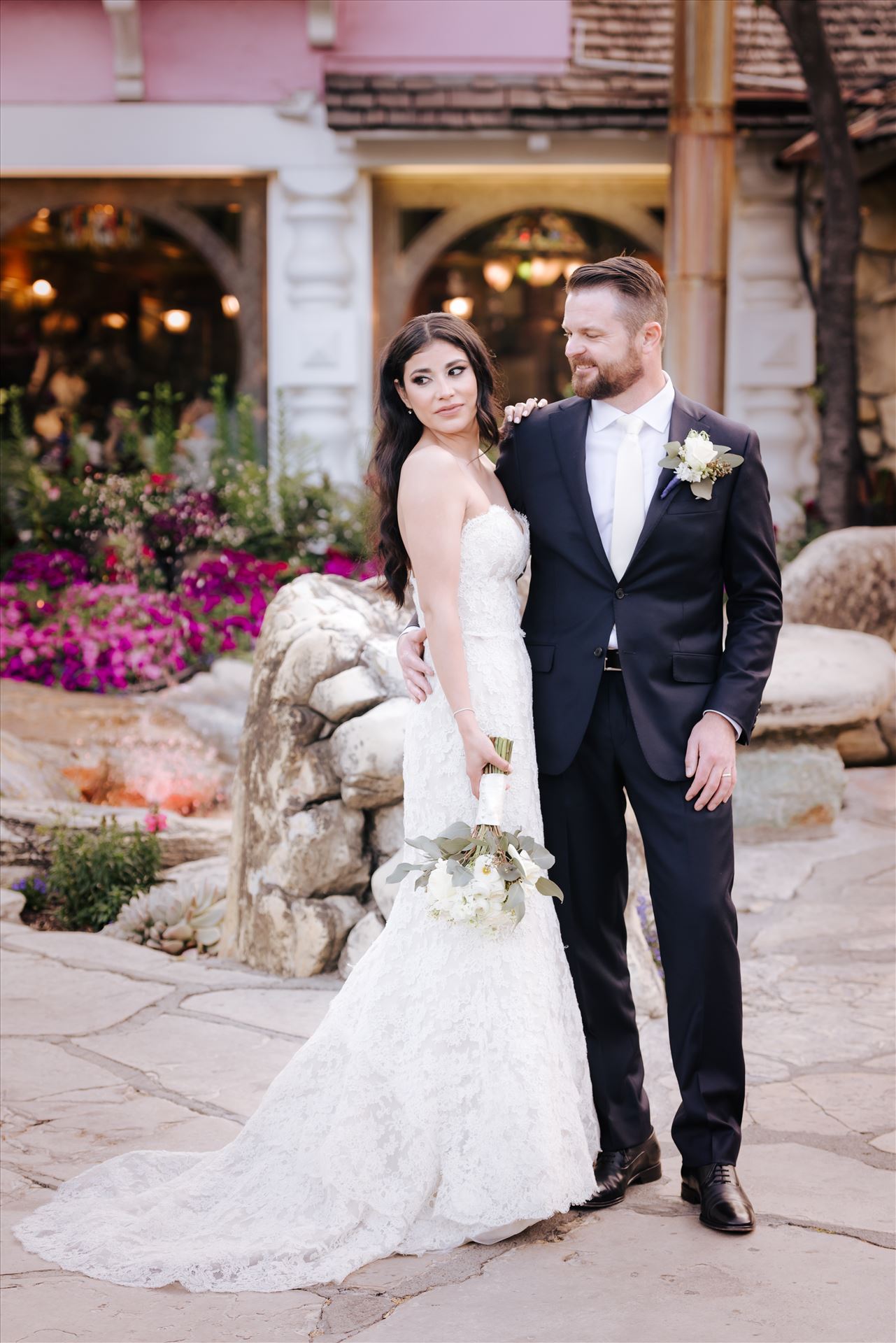 SP Gallery-5804.JPG - Mirror's Edge Photography captures Xochitl and David's magical Madonna Inn Wedding in San Luis Obispo, California. Bride and Groom in front of the Madonna Inn Restaurant and garden. by Sarah Williams