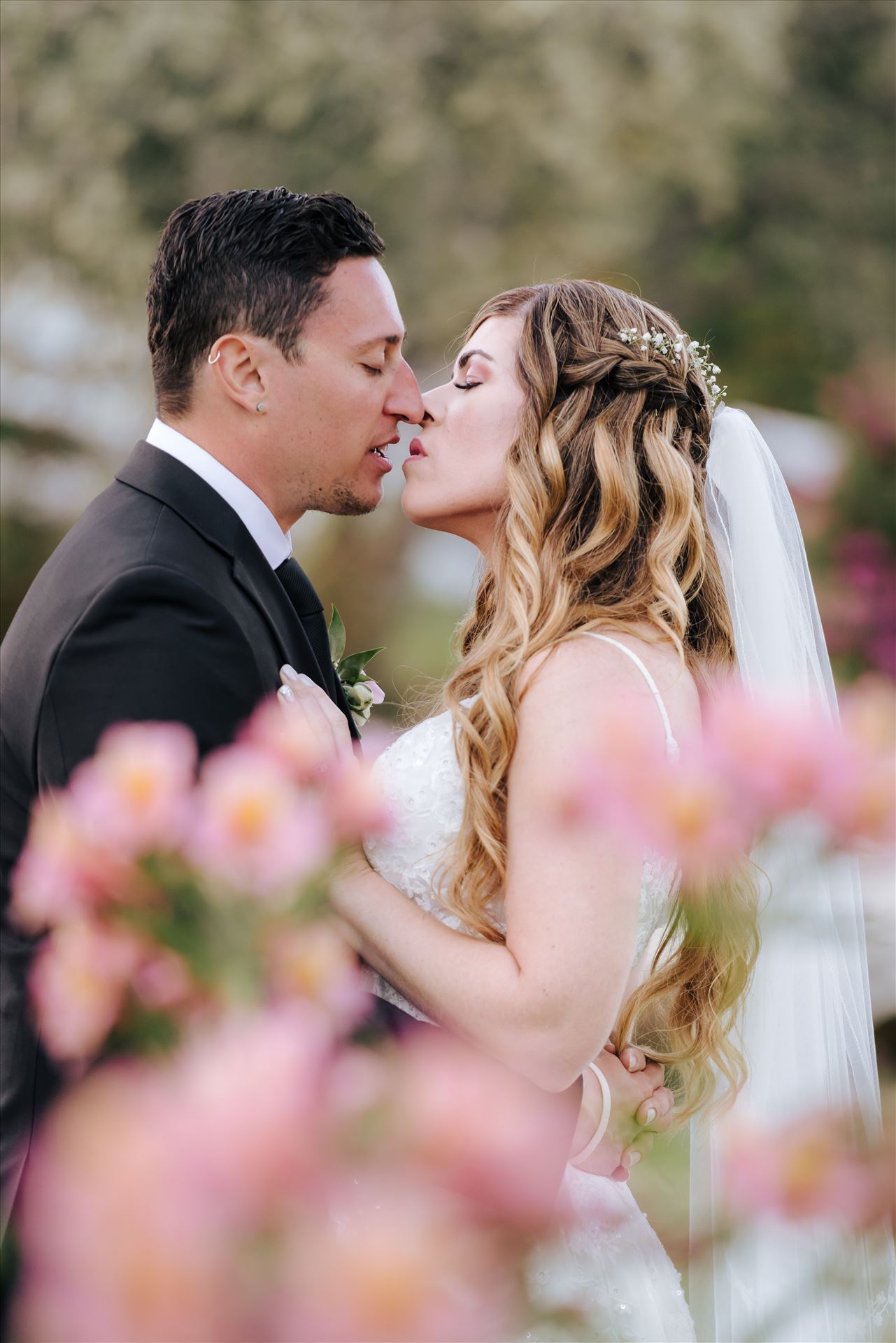 FW-6736.JPG - Mirror's Edge Photography, a San Luis Obispo Wedding and Engagement Photographer, captures Rashel and Brian's Wedding Day at the Madonna Inn in San Luis Obispo. A secret kiss in the secret garden. by Sarah Williams