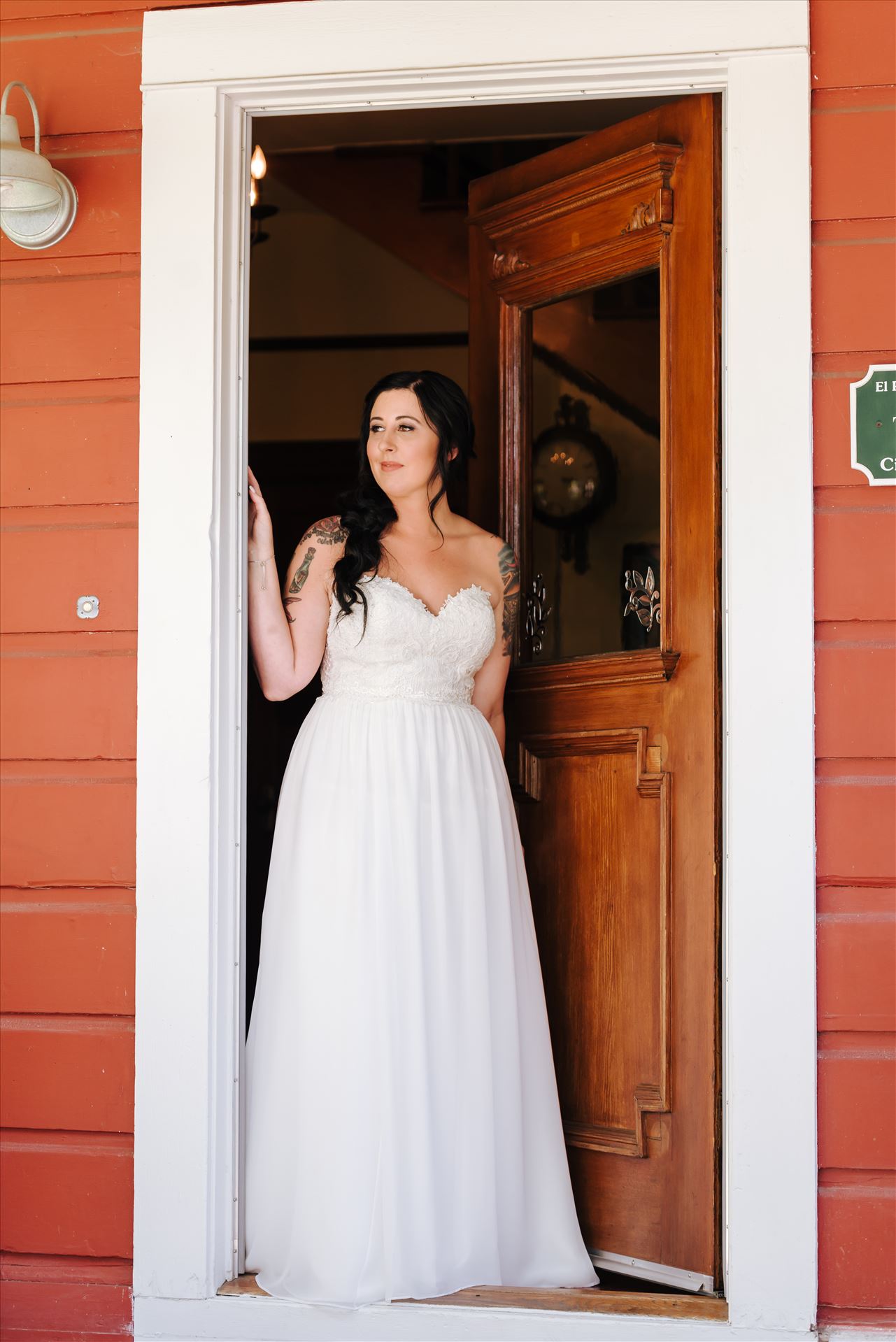 Kendra and Mitchell 027 - Emily House Bed and Breakfast Paso Robles California Wedding Photography by Mirrors Edge Photography.  Bride in the doorway by Sarah Williams