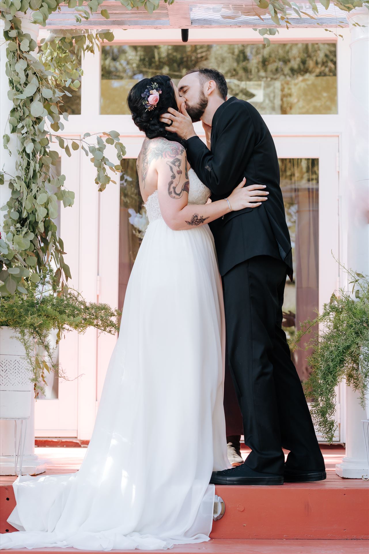 Kendra and Mitchell 062 - Emily House Bed and Breakfast Paso Robles California Wedding Photography by Mirrors Edge Photography.  Bride and Groom kiss by Sarah Williams