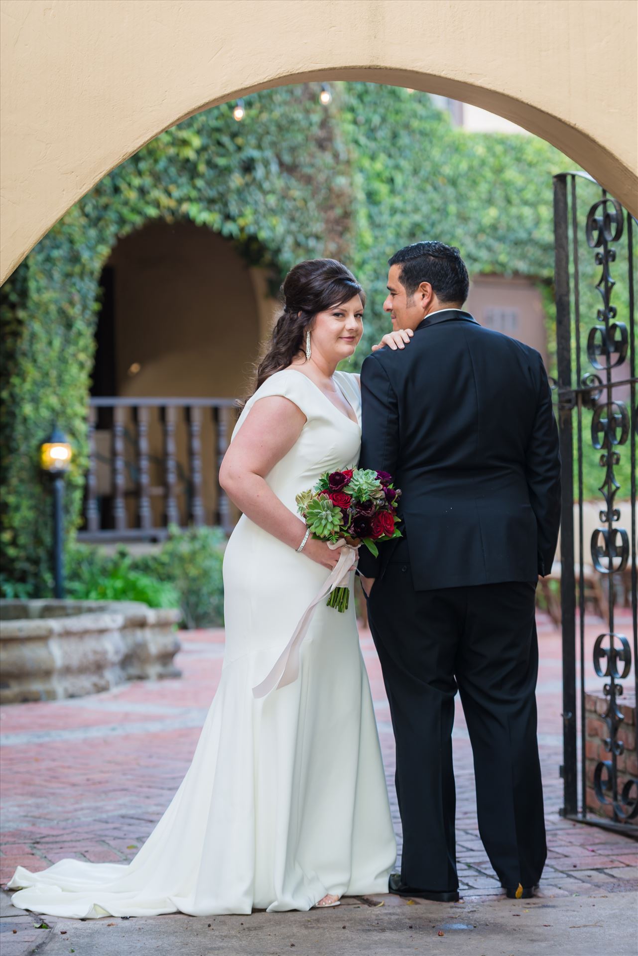 Mary and Alejandro 19 - Wedding photography at the Historic Santa Maria Inn in Santa Maria, California by Mirror's Edge Photography. Bride and Groom Hidden Courtyard. by Sarah Williams