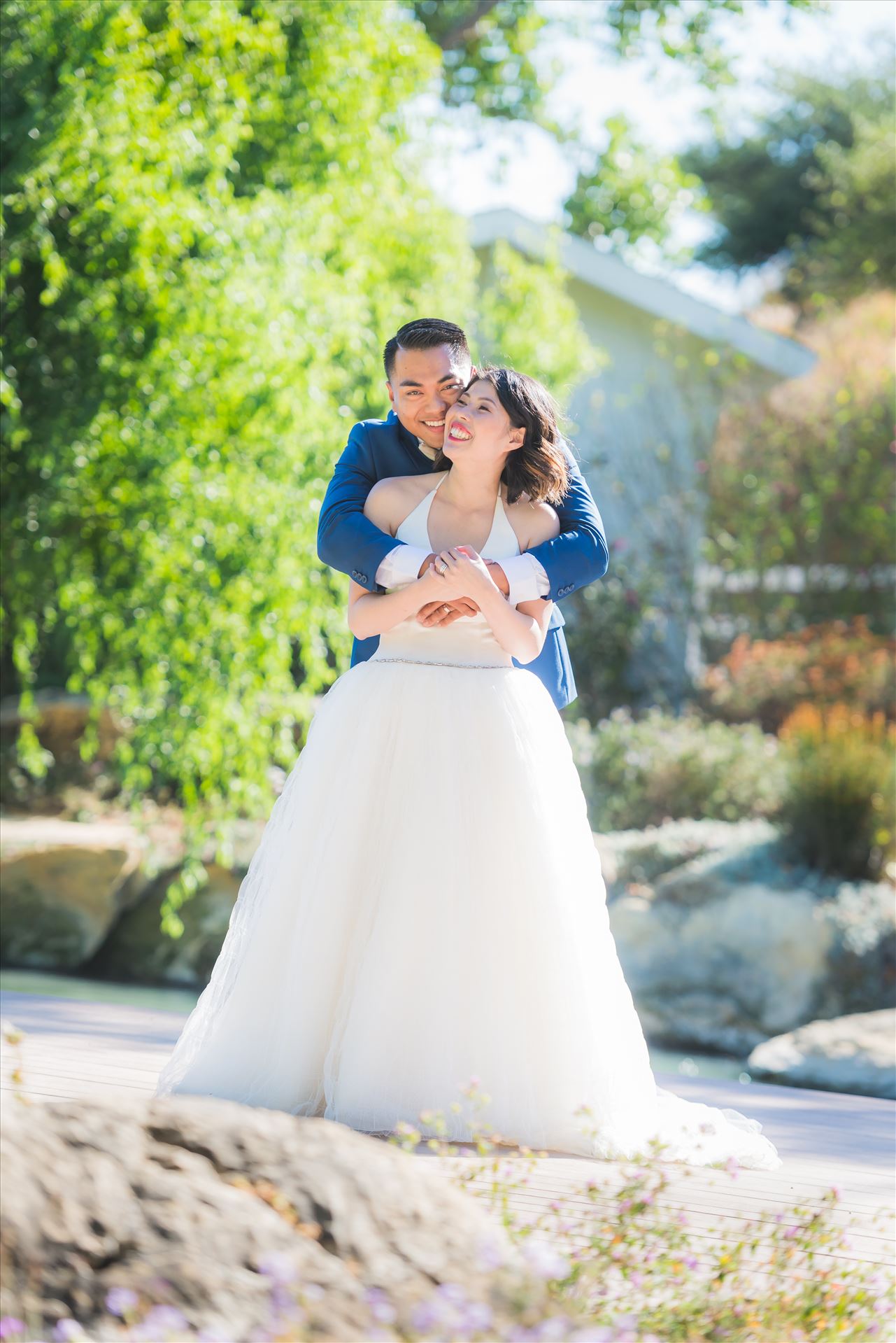 Maryanne and Michael at Madonna Inn 104 - Mirror's Edge Photography captures Maryanne and Michael's magical wedding in the Secret Garden at the iconic Madonna Inn in San Luis Obispo, California. Happy couple in the garden by Sarah Williams