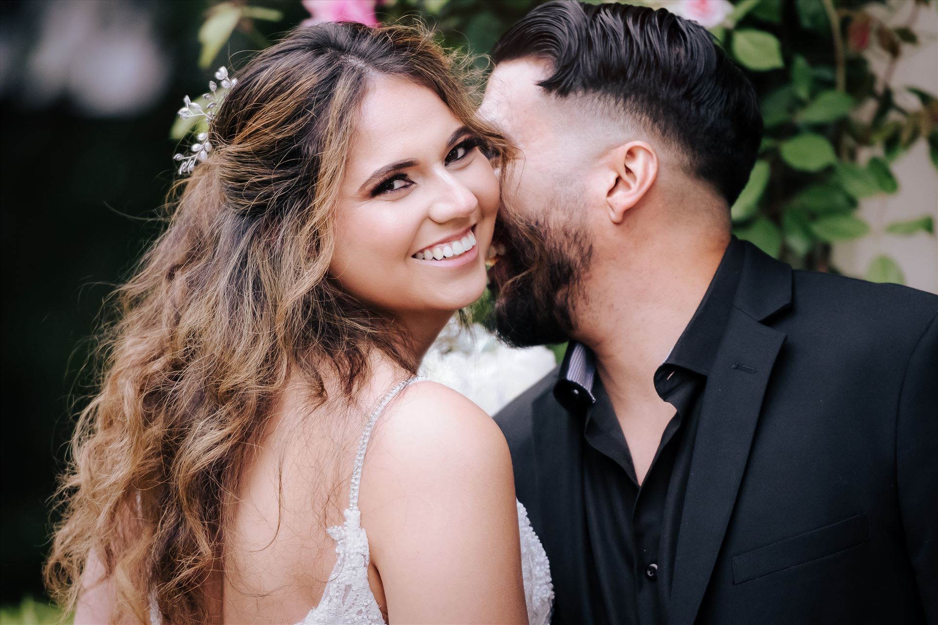 Final--23.JPGKaleidoscope Inn and Gardens wedding in Nipomo in San Luis Obispo County by Mirror's Edge Photography.  Gorgeous rose gardens and Victorian home vibe with romance and deep colors.  Bride and Groom kiss by the roses