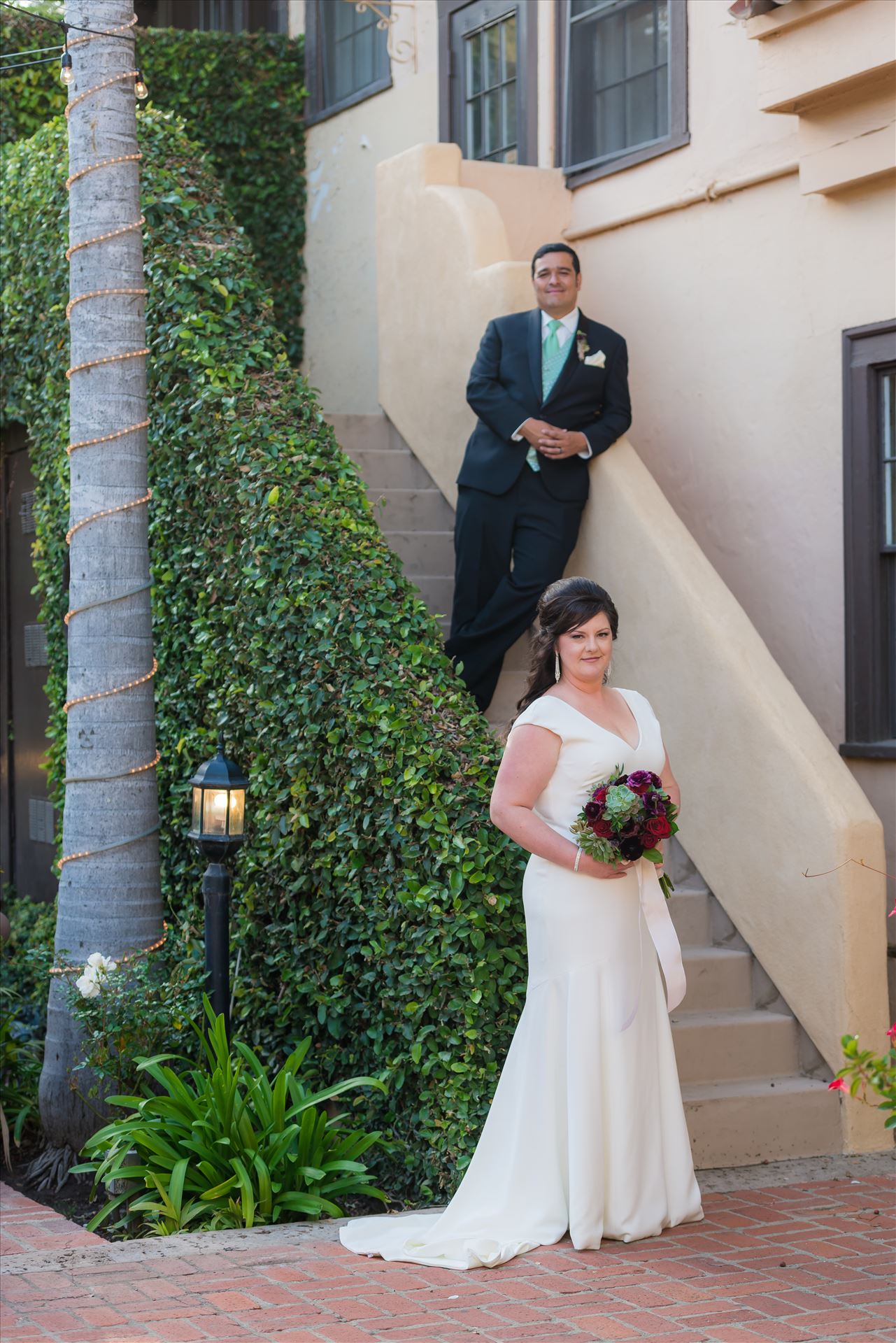 Mary and Alejandro 17 - Wedding photography at the Historic Santa Maria Inn in Santa Maria, California by Mirror's Edge Photography. Bride and Groom on the Ivy Staircase. by Sarah Williams