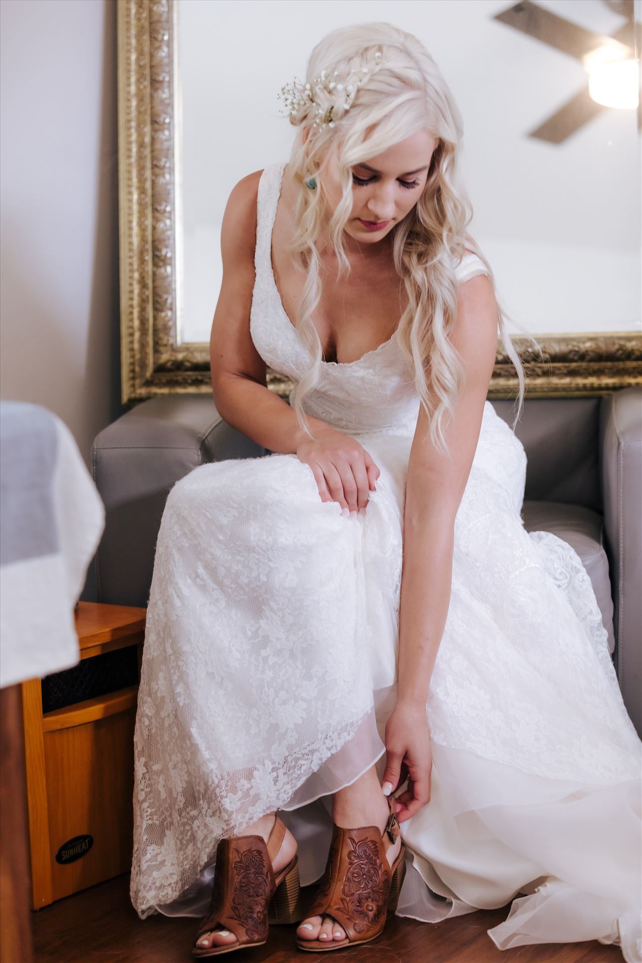 _Y9A6137.JPGPismo Beach Wedding in San Luis Obispo County by Mirror's Edge Photography.  Gorgeous windswept beach wedding vibes with a country and boho flair.  Bride putting on shoes.