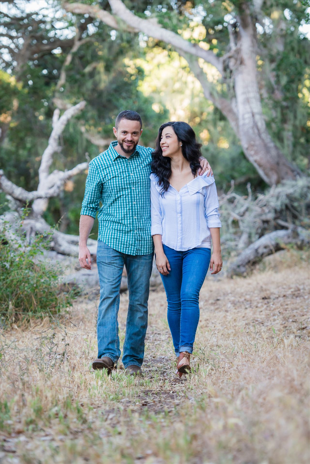 Cinthya and Carlos 55 - Los Osos State Park Reserve Engagement Photography and Wedding Photography by Mirror's Edge Photography.  Walking through the woods by Sarah Williams