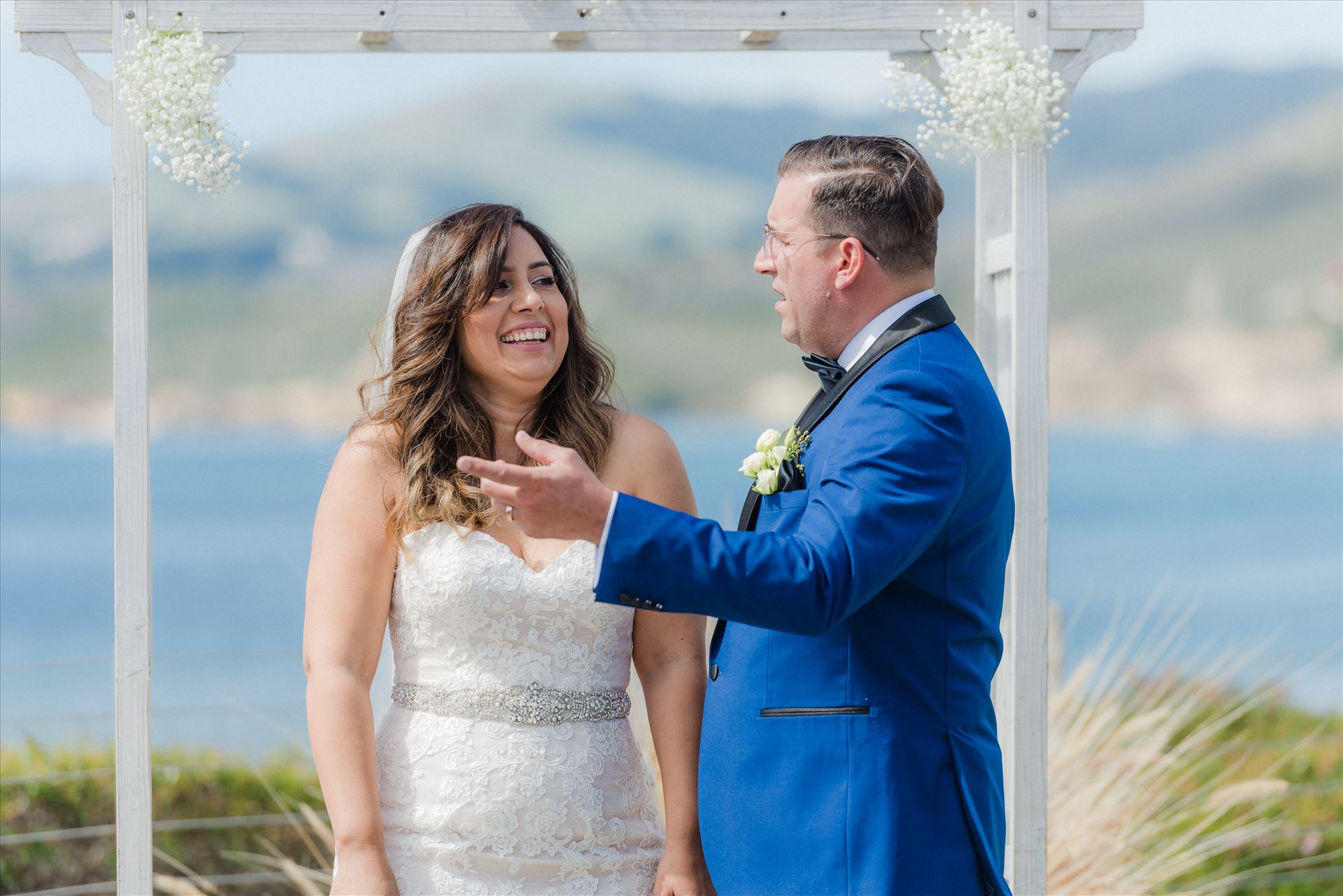 Candy and Christopher 13 - Wedding at Dolphin Bay Resort and Spa in Shell Beach, California by Sarah Williams of Mirror's Edge Photography, a San Luis Obispo County Wedding Photographer. Wedding vows at Spyglass by Sarah Williams