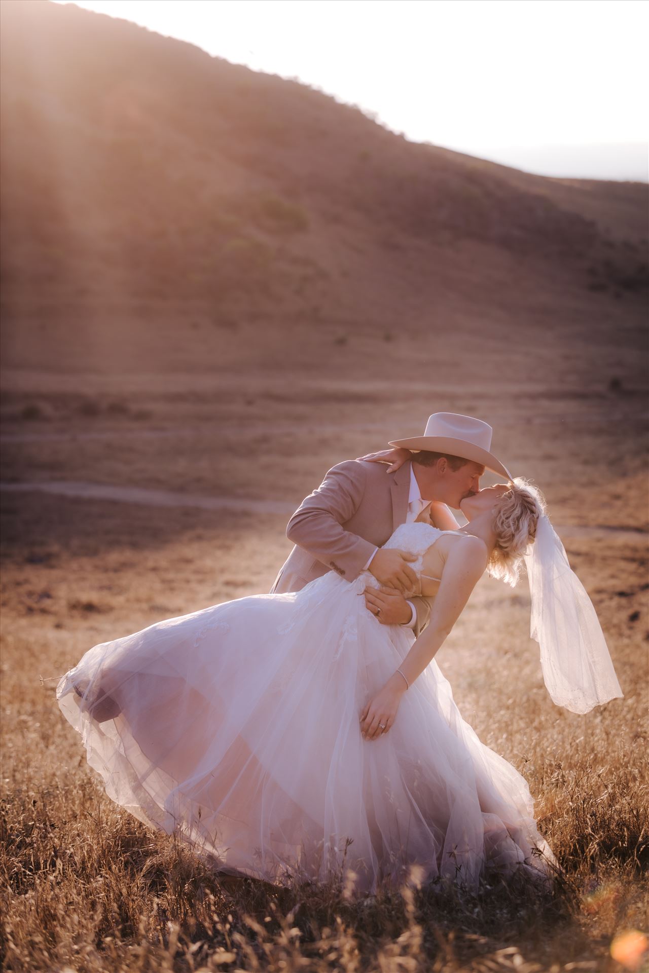 FW-1000.JPG - Sarah Williams of Mirror's Edge Photography, a San Luis Obispo and Santa Barbara County Wedding and Engagement Photographer, captures Katie and Joe's country chic wedding in Lompoc, California.  Sunset glow dip and kiss on the family ranch. by Sarah Williams