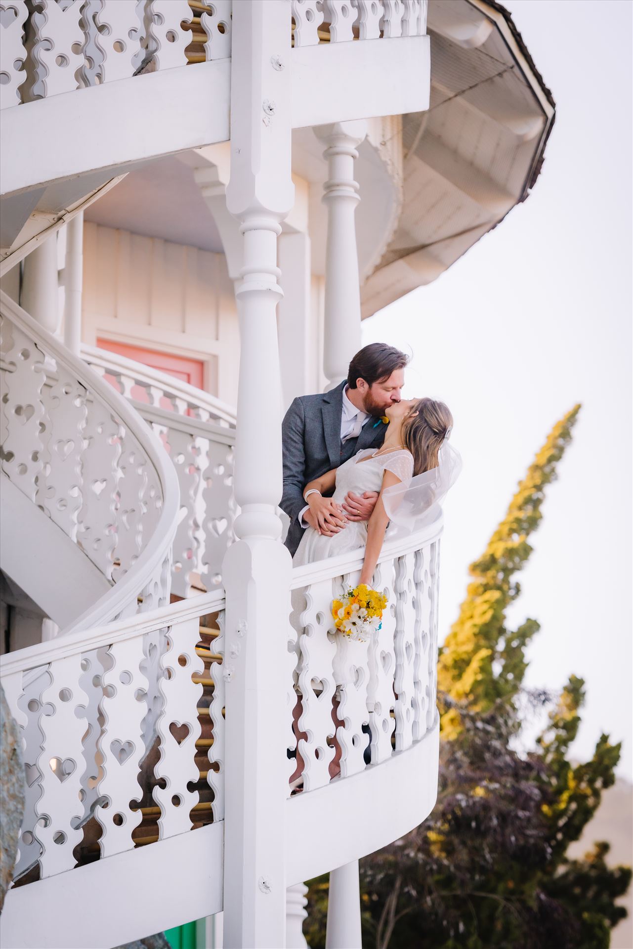 DSC_4250.JPG - Mirror's Edge Photography captures Sarah and David's magical Madonna Inn Wedding in San Luis Obispo, California.  Bride and Groom kissing on spiral staircase. by Sarah Williams