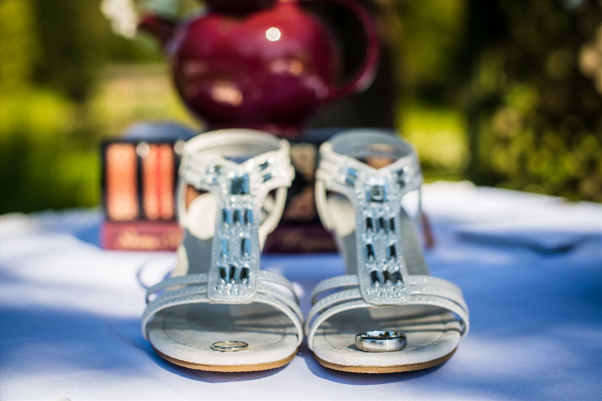 Renae and Brian 008 - Mirror's Edge Photography captures a high tea wedding at the Cypress Ridge Golf Club and Pavilion in Arroyo Grande, California.  Rings, shoes and a tea pot. by Sarah Williams