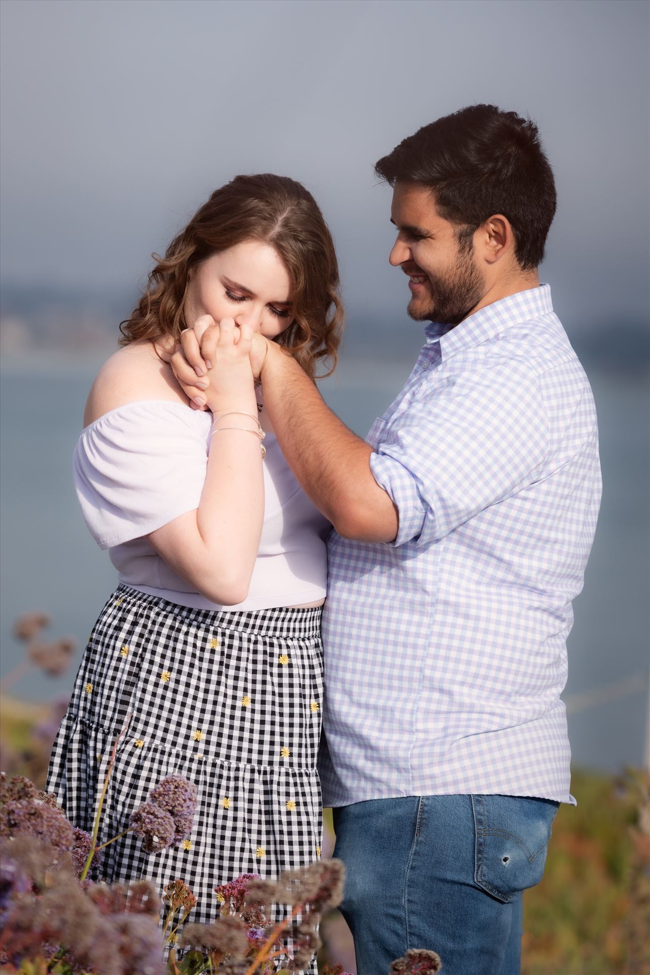 Final-75.JPG - Sarah Williams of Mirror's Edge Photography, a San Luis Obispo Wedding and Engagement Photographer, captures Kara-Leigh and Deaven's amazing Engagement Photography Session at the Dinosaur Caves Park in Pismo Beach California. Girl kisses hand. by Sarah Williams