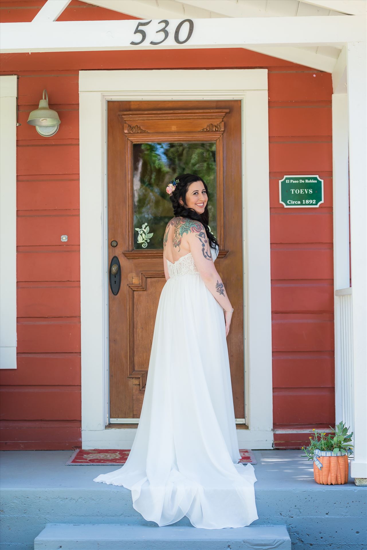 Kendra and Mitchell 029 - Emily House Bed and Breakfast Paso Robles California Wedding Photography by Mirrors Edge Photography. Bride on the porch by Sarah Williams