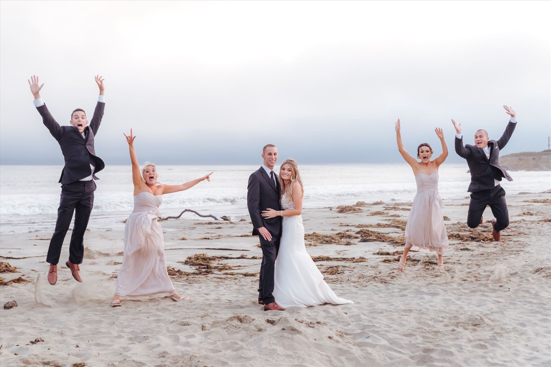 Courtney and Doug 69 - Mirror's Edge Photography, San Luis Obispo Wedding Photographer captures Cayucos Wedding on the beach and bluffs in Cayucos Central California Coast. Wedding Party Bridal Party fun at the Beach by Sarah Williams