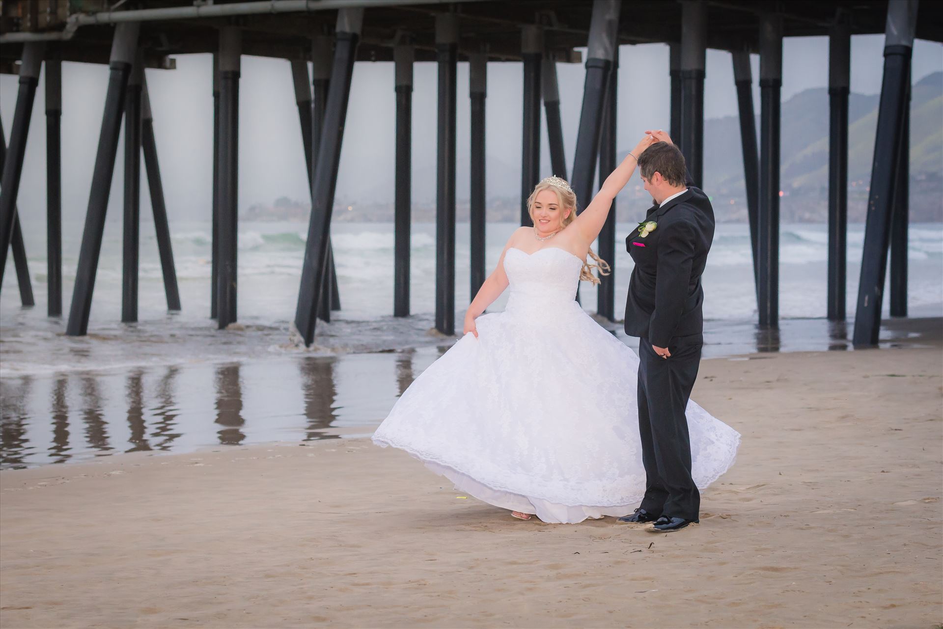 Jessica and Michael 68 - Sea Venture Resort and Spa Wedding Photography by Mirror's Edge Photography in Pismo Beach, California. Bride and Groom at Pismo Beach Pier by Sarah Williams