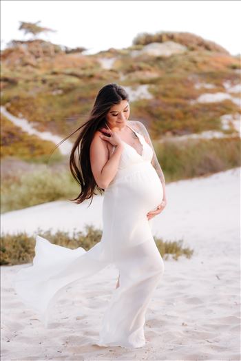 Sarah Williams of Mirror's Edge Photography, a San Luis Obispo County Wedding, Luxury Boudoir and Maternity Photographer captures Ali Marie and Cody's Maternity Session in Pismo Beach. Beautiful Mother to be on white sand dunes ocean background