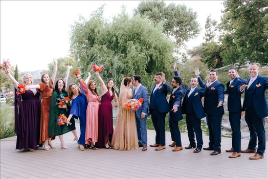 A gorgeous Madonna Inn Wedding by Mirror's Edge Photography a San Luis Obispo Wedding and Engagement Photographer.  Bride and Groom at sunset.  70's theme wedding bridal party