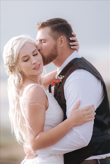 Mirror's Edge Photography, a San Luis Obispo County Wedding and Engagement Photographer, captures Sarah and Jeremy's intimate wedding on Pismo State Beach in Grover Beach, California.  Bride and Groom intimate moment on the beach