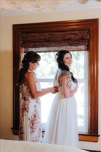Emily House Bed and Breakfast Paso Robles California Wedding Photography by Mirrors Edge Photography. Mom and Bride putting on the dress